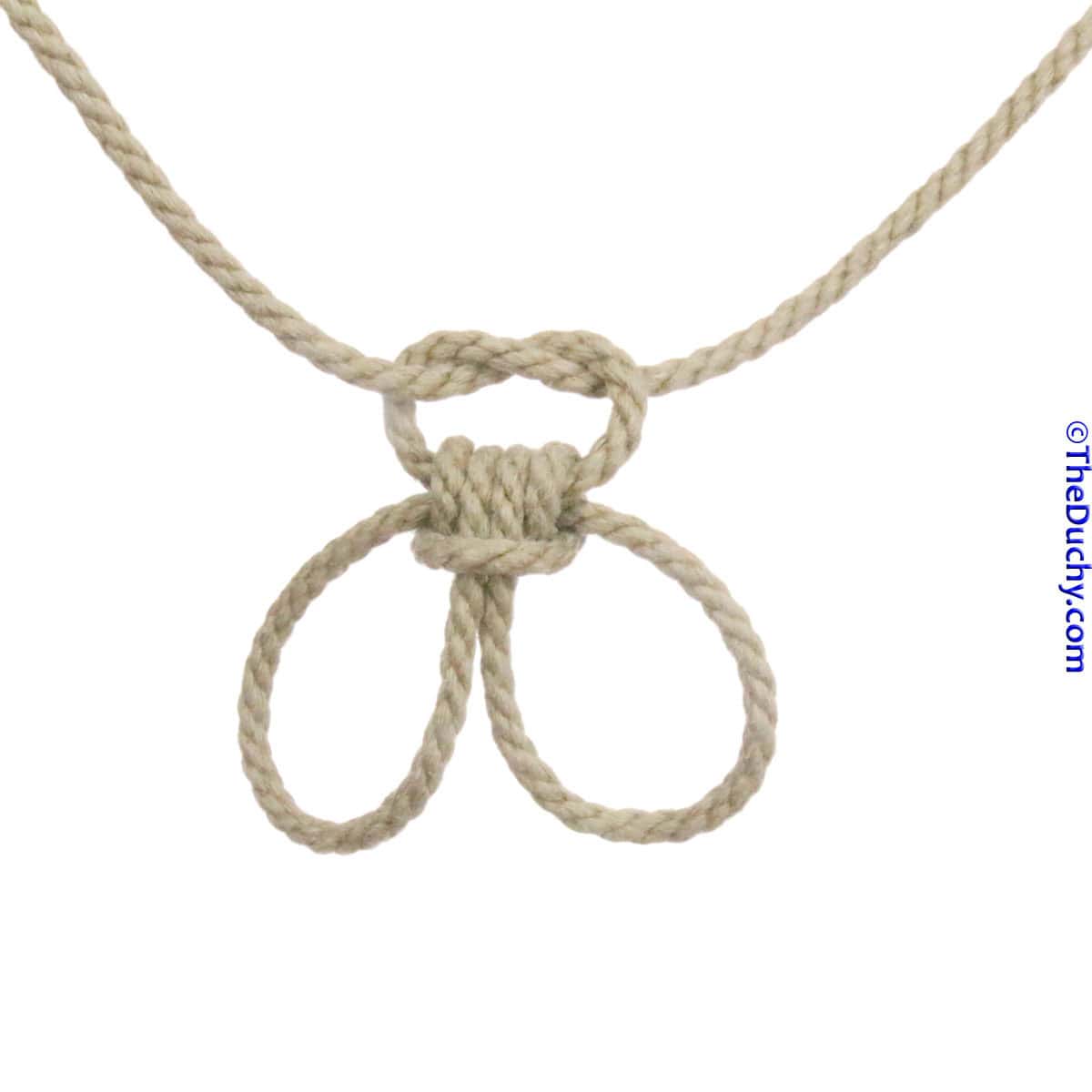 2. Once you put their wrists in the cuffs, “lock” them with an overhand