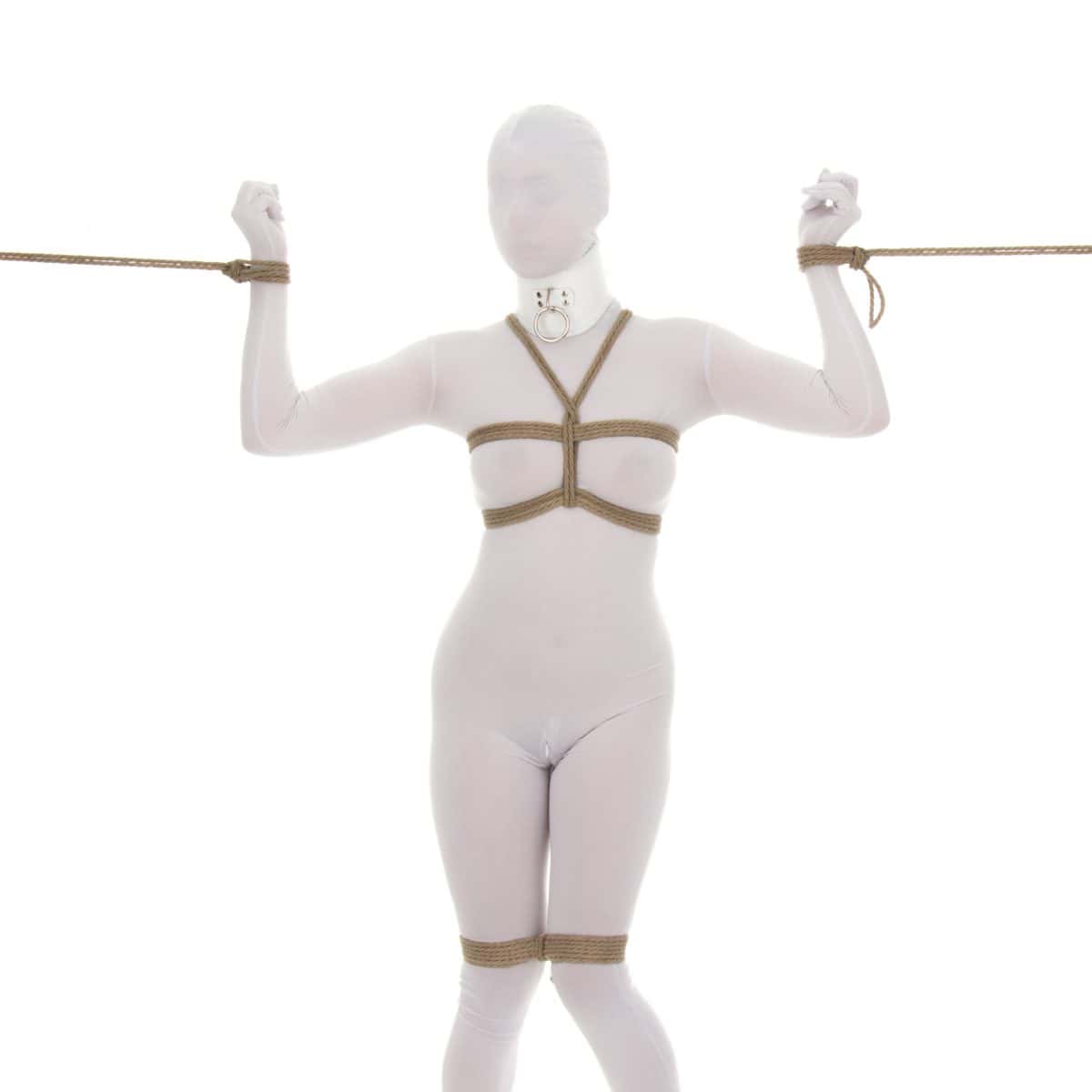 A woman in a white zentai poses with various shibari rope ties on her chest, knees, and wrists